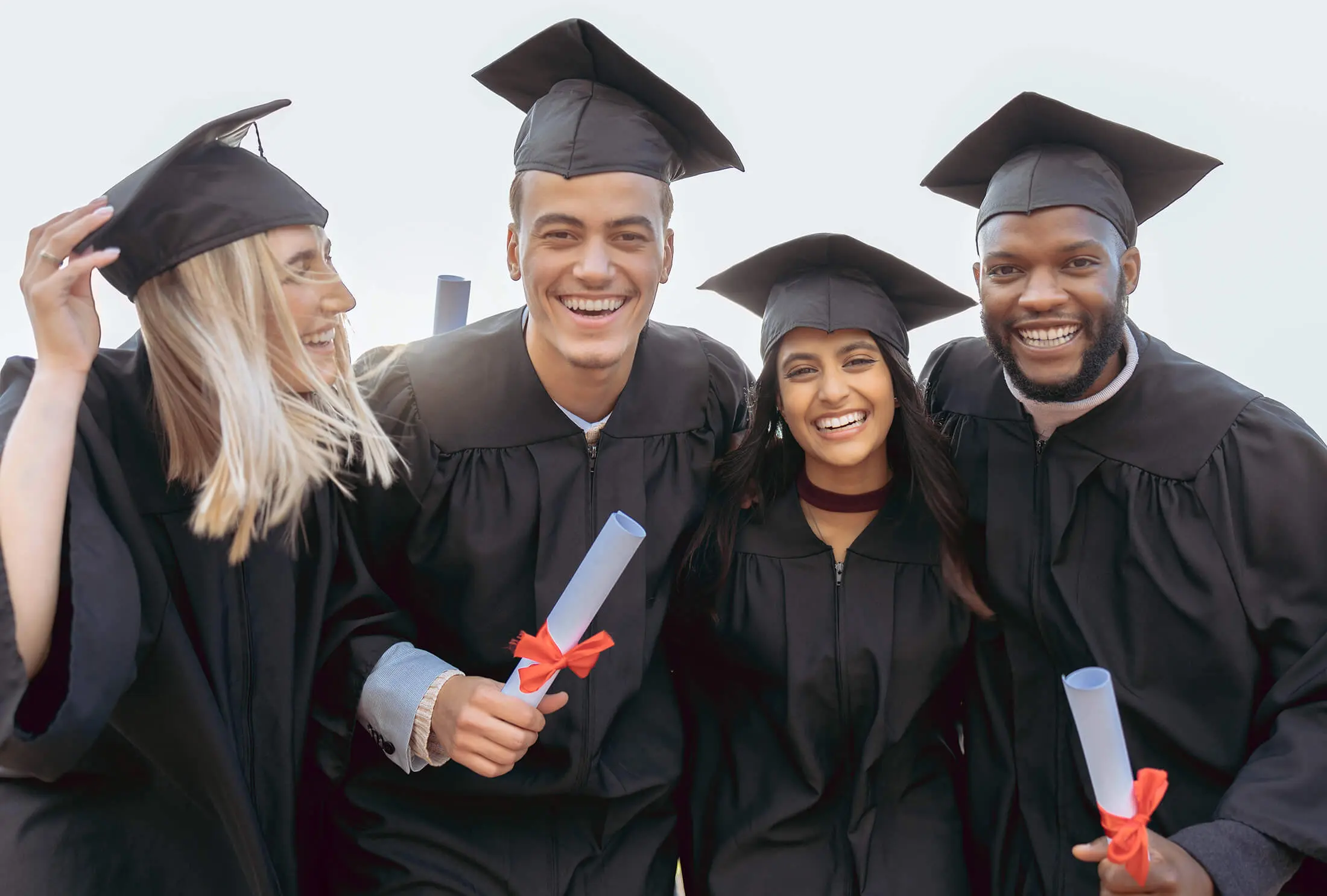 photograph of group of graduates wearing gown