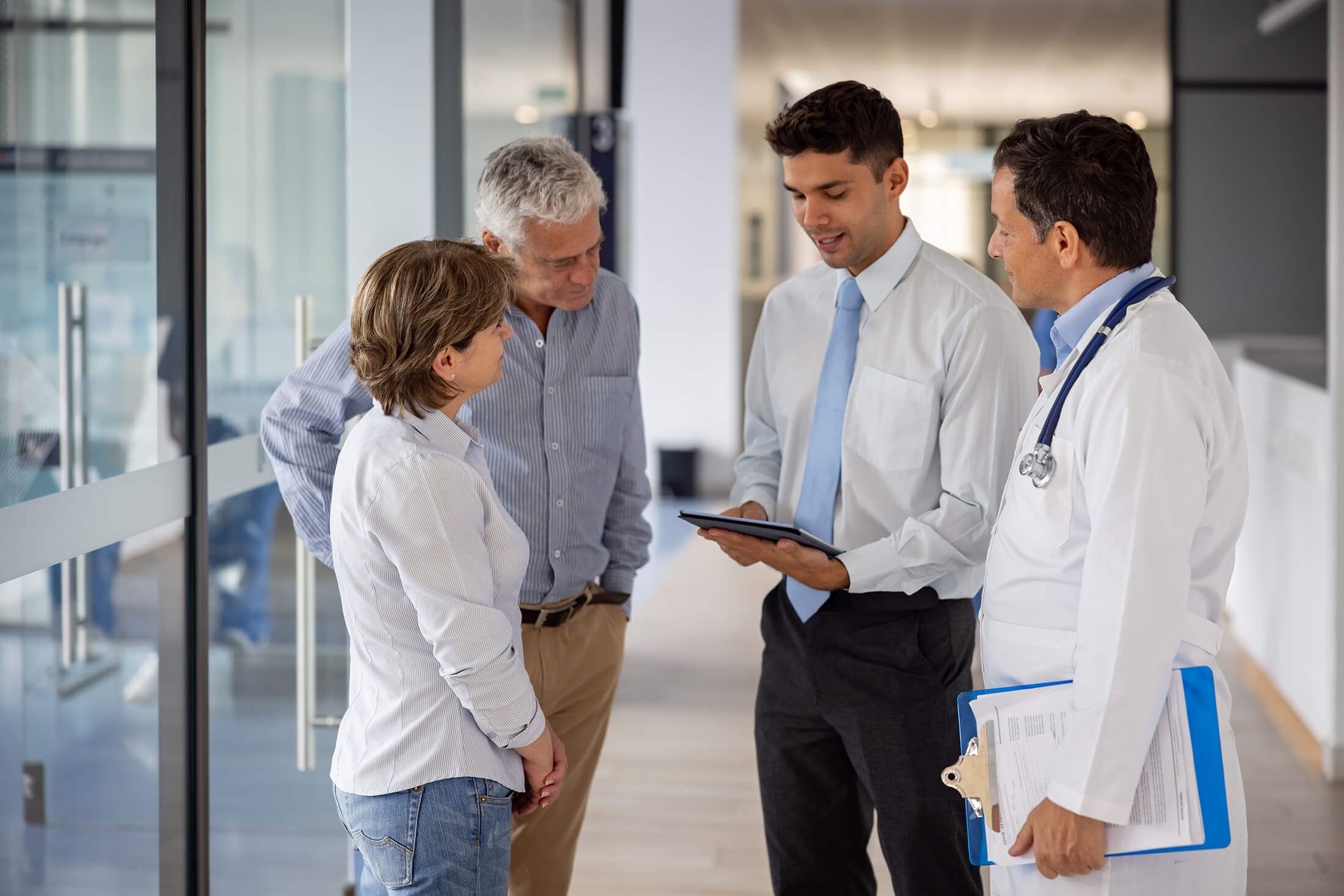 Group of medical professionals having a chat in the hallway