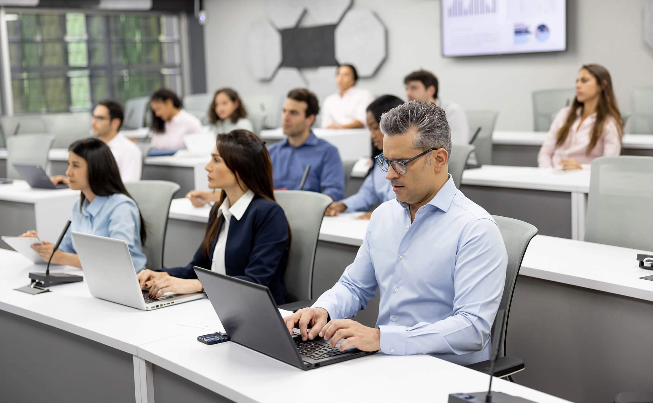 group of people sitting in a classroom