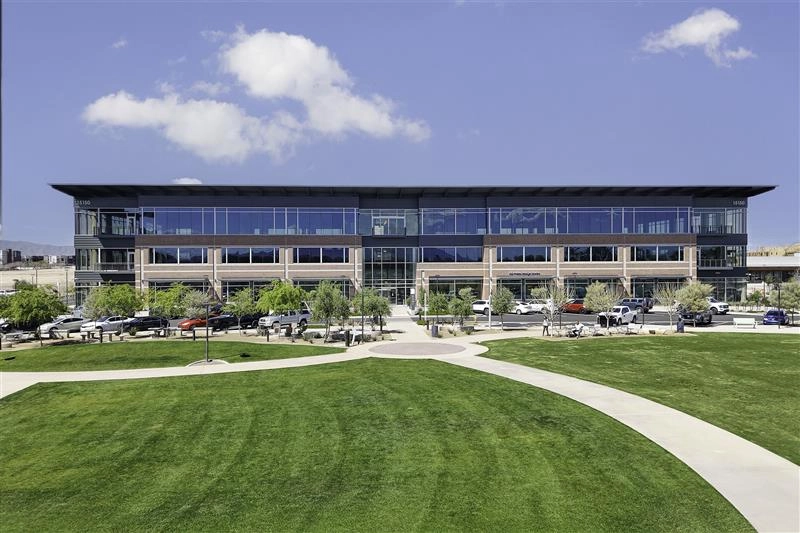 Goodyear Civic Square, a modern office building with a glass facade and green surroundings.