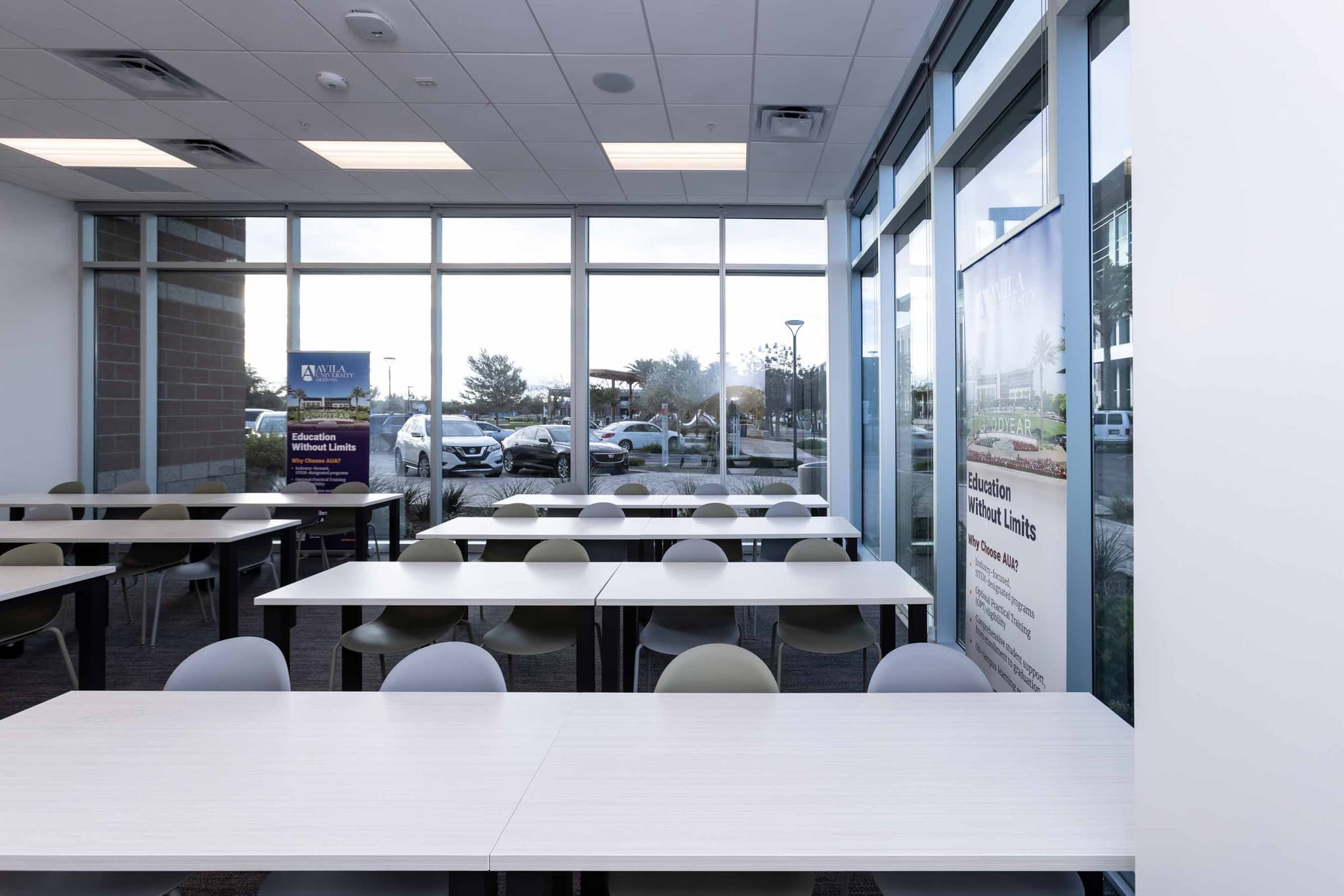 classroom with large windows and student desks